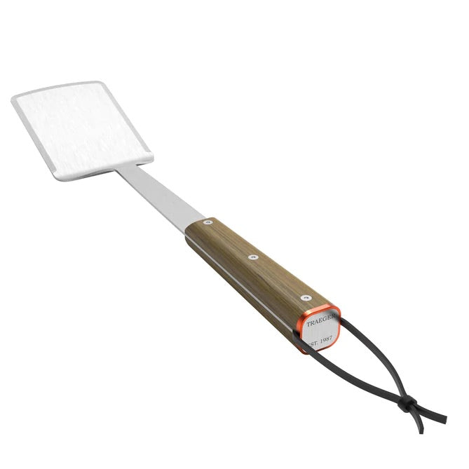 Stainless steel Traeger BBQ spatula, angled view